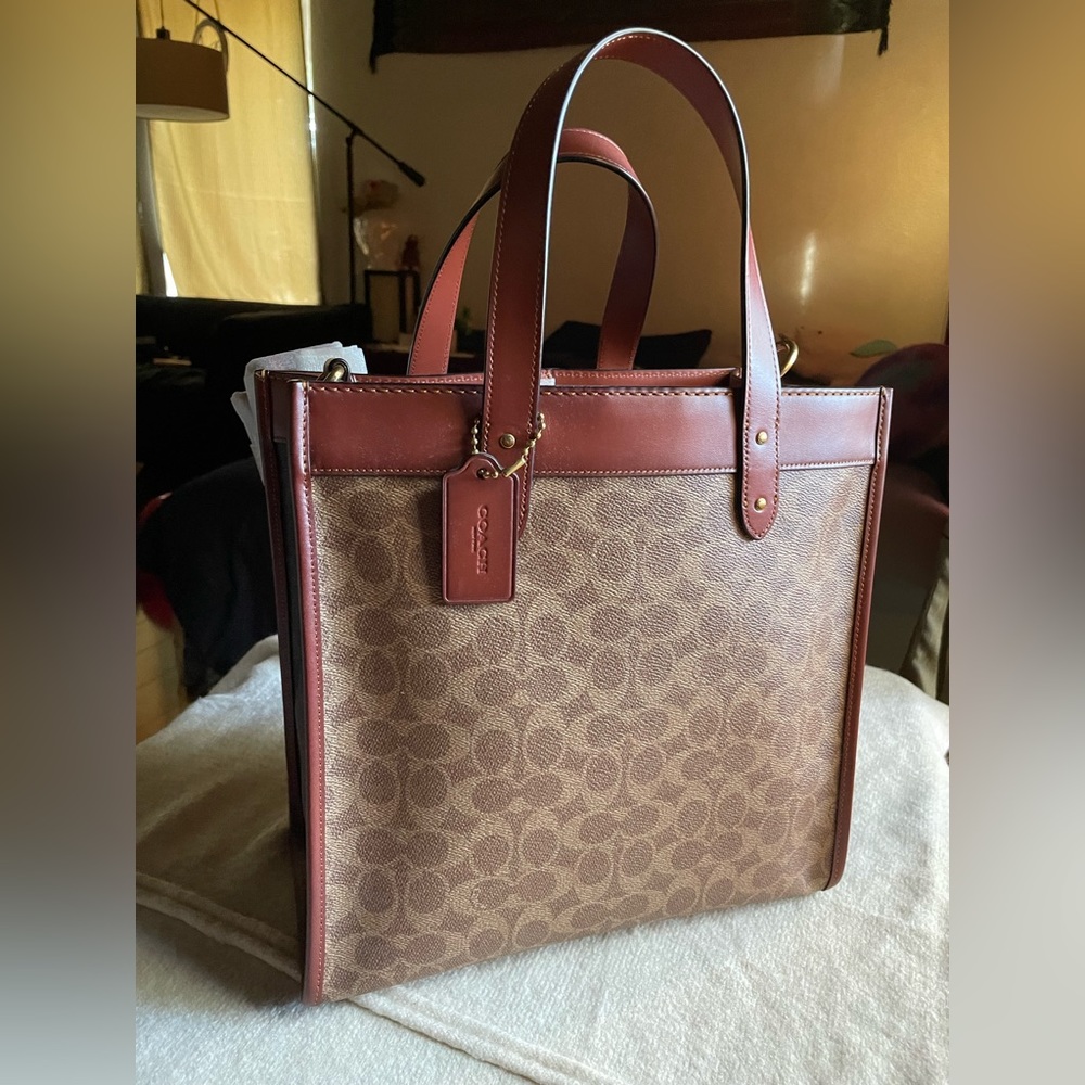 coach shoulder/hand bag. Brand new with tags. Beautiful Caramel and tan color.